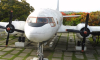 Preserved Ilyushin Il-14 aircaft on display next to terminal, it was used as a bar in the past